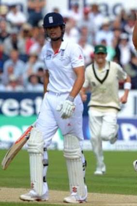 Ryan Harris celebrates after taking the wicket of England captain Alastair Cook.