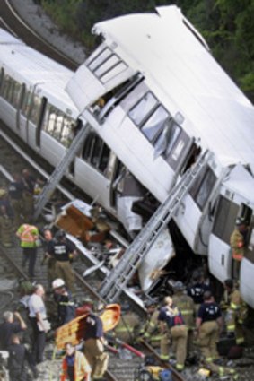 Emergency workers at the site of the rush-hour train collision in Washington DC.