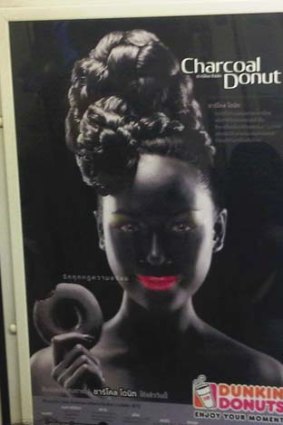 Offensive: A leading human rights group has called on Dunkin' Donuts to withdraw the "bizarre and racist" advertisement for chocolate doughnuts in Thailand.