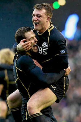 Tim Visser (L) and Stuart Hogg celebrate Scotland's win.
