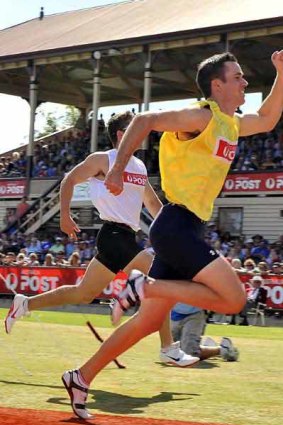 Too quick . . . Tom Burbidge claims the Stawell Gift yesterday.