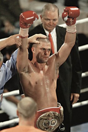 Winner's corner … Taylor wins the IBF Pan Pacific light middleweight title in 2003.