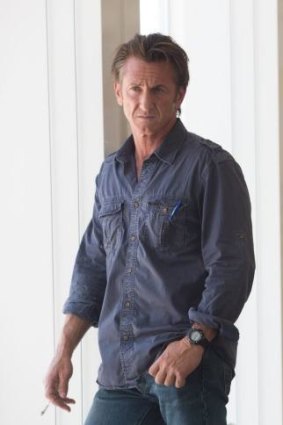 Sean Penn produced, co-wrote and stars in <i>The Gunman</i>.
