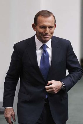 Satisfied: Opposition leader Tony Abbott after delivering his budget response.