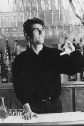 Tom Cruise behind the bar in a scene from the film <i>Cocktail</i>.