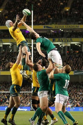High point: Ben Mowen seizes a lineout during the 32-15 win over Ireland in Dublin.