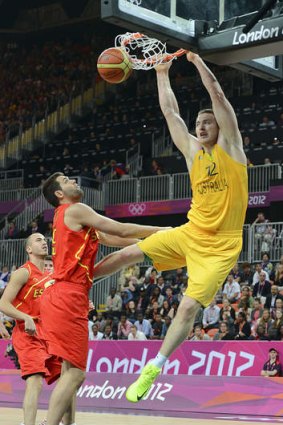 Boomers centre Aron Baynes slam-dunks against Spain during the London Olympics.