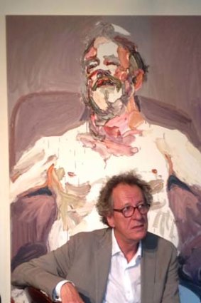 Geoffrey Rush with the portrait of Billie Brown, which he has loaned to the Bille Brown Studio in South Brisbane.