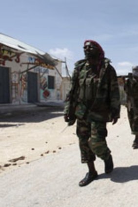 Al-Qaeda-affiliated al Shabab rebels patrol in Mogadishu.