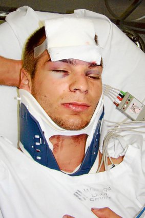 Victim ... Luke Adams in hospital after being bashed at Hungry Jack's last July.