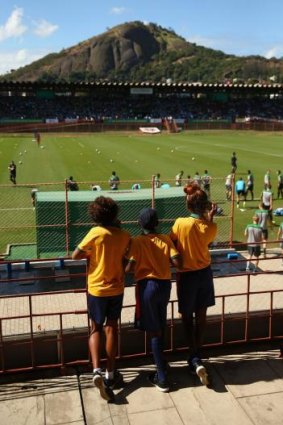 Looking ahead: Young indigenous soccer players, from the John Moriarty Football team in the Northern Territory, at a Socceroos training session in Vitoria, Brazil, last month.
