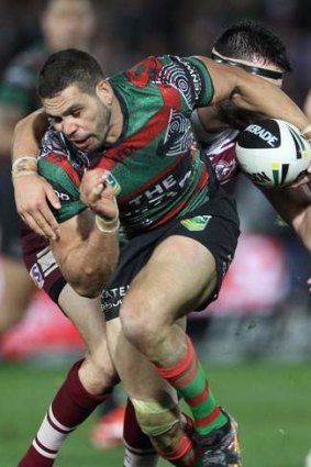 Breaking the line: Greg Inglis and the Rabbitohs tackle the Sea Eagles on Friday night.