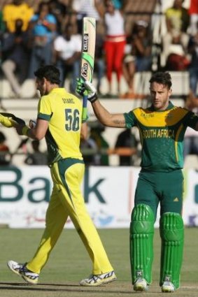 Faf du Plessis acknowledges the crowd after reaching his hundred.