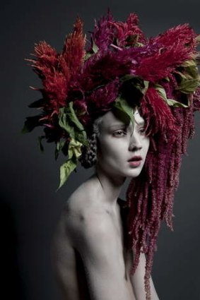 Femme fatale: Carine Thevenau depicts a siren of the woods who consumes men beneath her forest of hair.