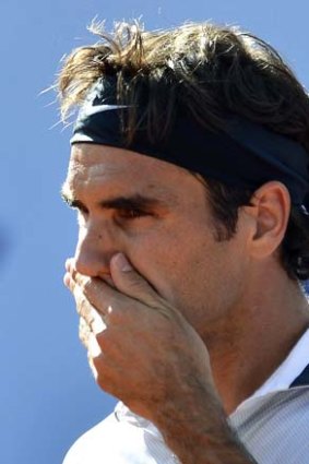 Shattered: Roger Federer falls at the Swiss Open.