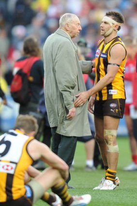 Good try: John Kennedy snr consoling Luke Hodge after the game.