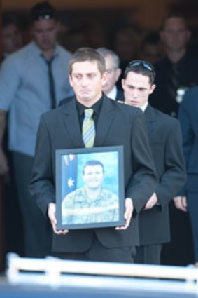 A lost soldier ... family and friends of Private Nathan Bewes leave the church in Murwillumbah.