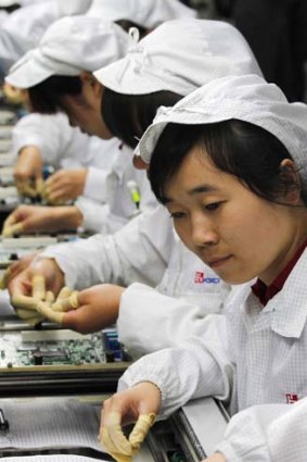 Bleak conditions ... workers at a Foxconn factory in the township of Longhua in China's southern Guangdong province.