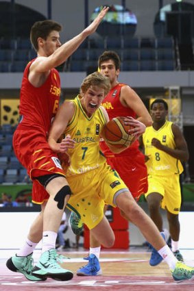 Tom Wilson of Australia drives against Xabier Lopez-Arosteguj of Spain during the FIBA under 17 World Championships semi-final match.