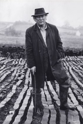 Poet Seamus Heaney stands in his local peat bog, near Bellaghy in Northern Ireland.