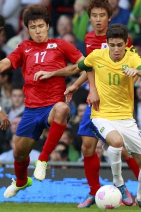 New face: Oscar (right), who has joined Chelsea, shows his style during Brazil's clash with South Korea at the Olympics.