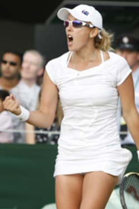 Anastasia Rodionova of Australia reacts as she defeats Svetlana Kuznetsova of Russia.