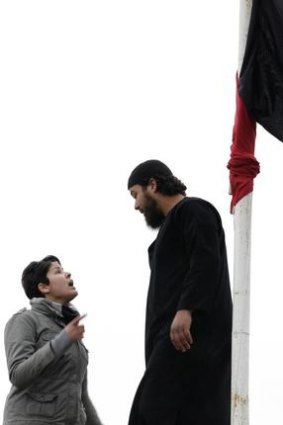 A secular student clashes with a Salafist, after he replaced the Tunisian flag with a black flag that reads: 'there is no god but Allah and Mohammad is the prophet'.