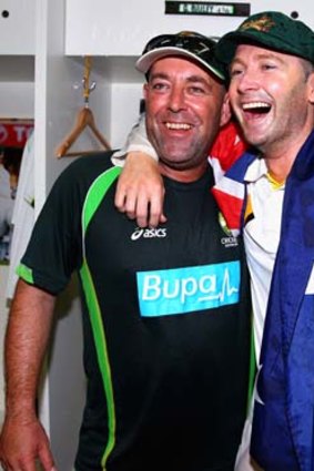 A jubilant Michael Clarke (right) with Lehmann in the change rooms.
