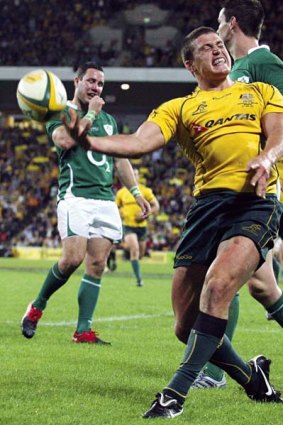 Double trouble ... Australia's Luke Burgess celebrates after scoring one of his two tries against Ireland in Brisbane on Saturday night.