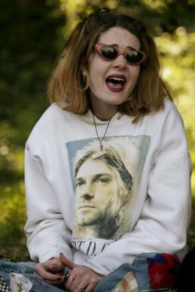 A Nirvana fan wears a hoodie with an image of Kurt Cobain.