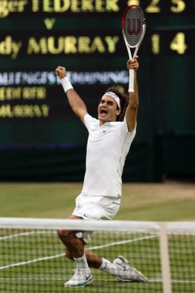 Roger Federer celebrates his seventh Wimbledon men's singles title.