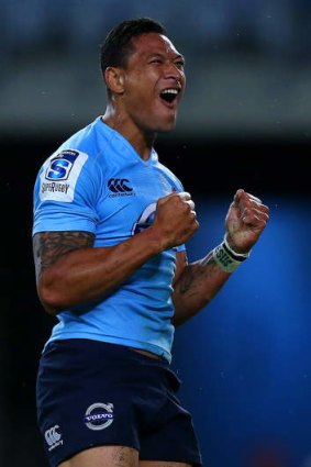 Israel Folau celebrates a try against the Reds.