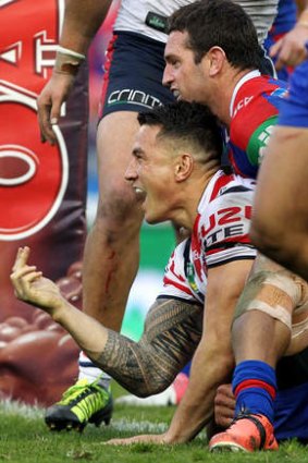 On report: Sonny Bill Williams celebrates a try in Newcastle.