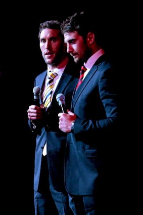 The All-Australian captain for 2012, West Coast's Darren Glass (left) speaks with Essendon's Jobe Watson last night.