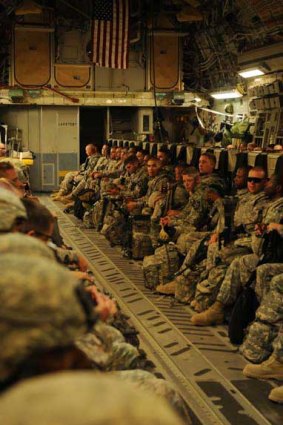 End game: US soldiers board an aircraft for their return home from Iraq. <i>Picture: AP</i>