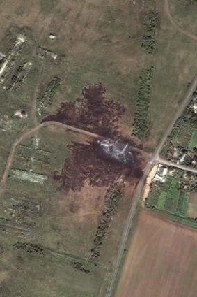 PM warns of evidence tampering: Satellite image of MH17 crash site.