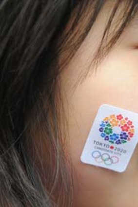 Let the Games begin: a Japanese student helps sell the 2020 pitch to the visiting IOC.