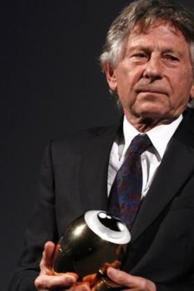 Director Roman Polanski with his lifetime achievement award at the Zurich Film Festival. Polanski  collected the award from the Zurich Film Festival intended for him in 2009.