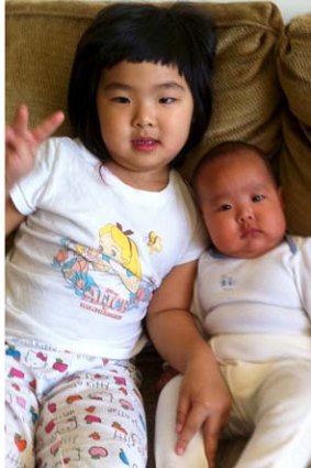 Parent's love: Ms Gu's two children.