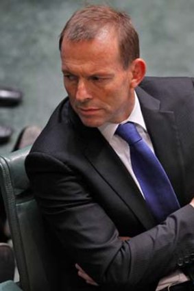 Tony Abbott during yesterday’s showdown in which the PM was told she should resign.