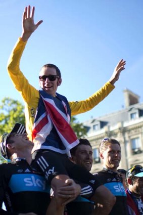 Moment of glory: Bradley Wiggins celebrates with his teammates after his win in the 2012 Tour de France.
