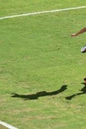 Spain's Jordi Alba leaps over Australia's Mathew Leckie, one of the Socceroos' best.