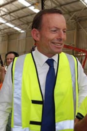 Strapped in &#8230; Tony Abbott visits a trussing factory.