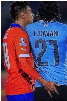 Jara pokes Cavani.