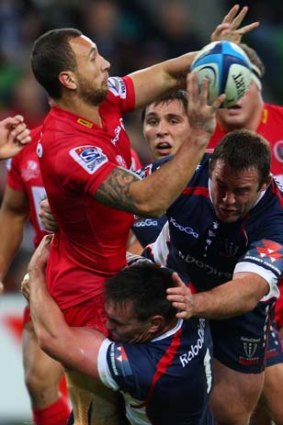 Quade Cooper looks to get an offload away.