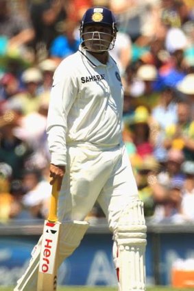 Gone ... India's Virender Sehwag of India leaves the field after being caught by Haddin of Pattinson.