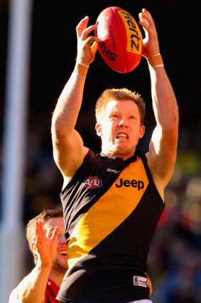 Jack Riewoldt of the Tigers takes a mark during the  match between the Melbourne Demons and Richmond at the MCG.