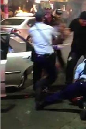 Police forcibly restrained the teenager.