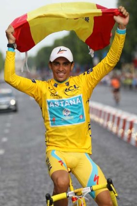 Jubilant . . . Alberto Contador on the Champs-Elysees.