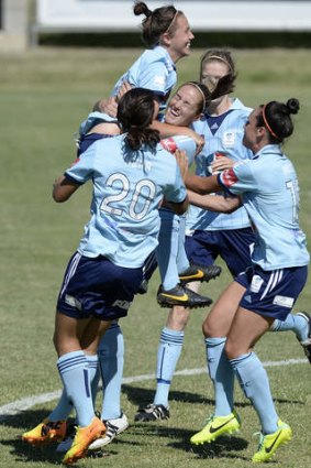 Top of the world: Renee Rollason of Sydney celebrates her goal.